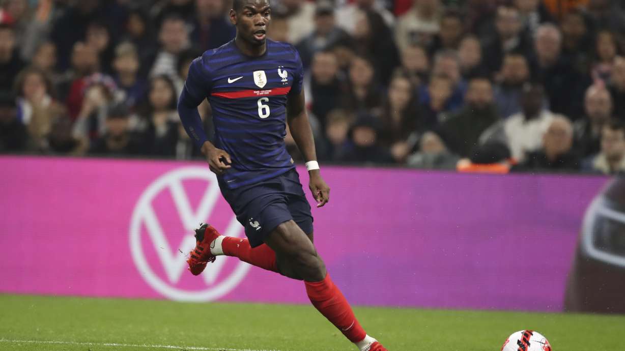 FILE - France's Paul Pogba runs with the ball during an international friendly soccer match against Cote d'Ivoire at the Velodrome stadium in Marseille, France, March 25, 2022.