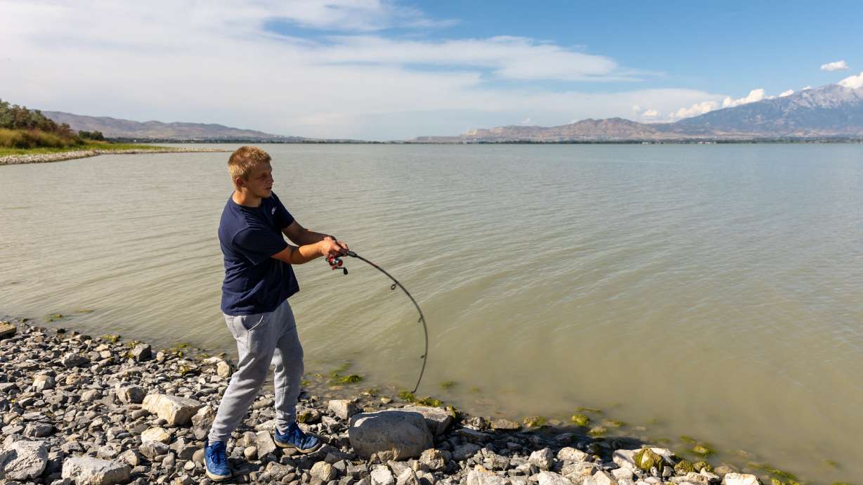 Joshua Larson fishes Utah Lake in Saratoga Springs on Aug. 22, 2022. Utah Rep. Blake Moore wants to revise the Stamp Act of the Pittman Robertson Wildlife Restoration Trust Fund to support related lawful activities.