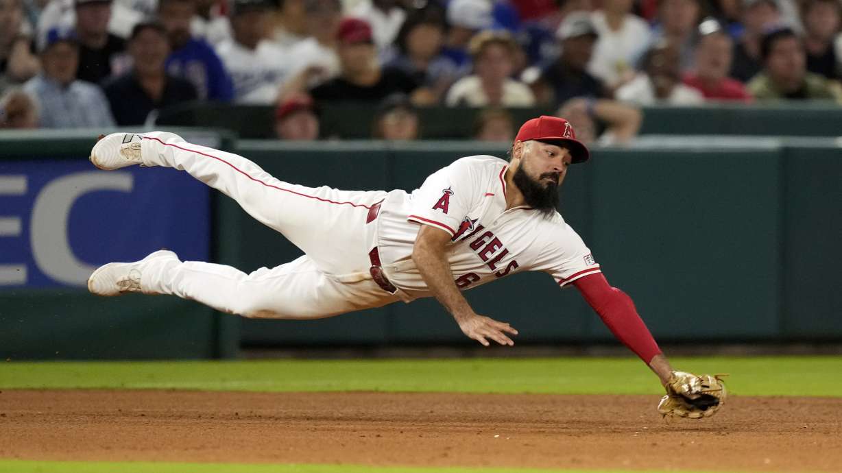 Los Angeles Angels third baseman Anthony Rendon can't get to a ball hit for an RBI single by Los Angeles Dodgers' Andy Pages during the seventh inning of a baseball game, Wednesday, Sept. 4, 2024, in Anaheim, Calif.