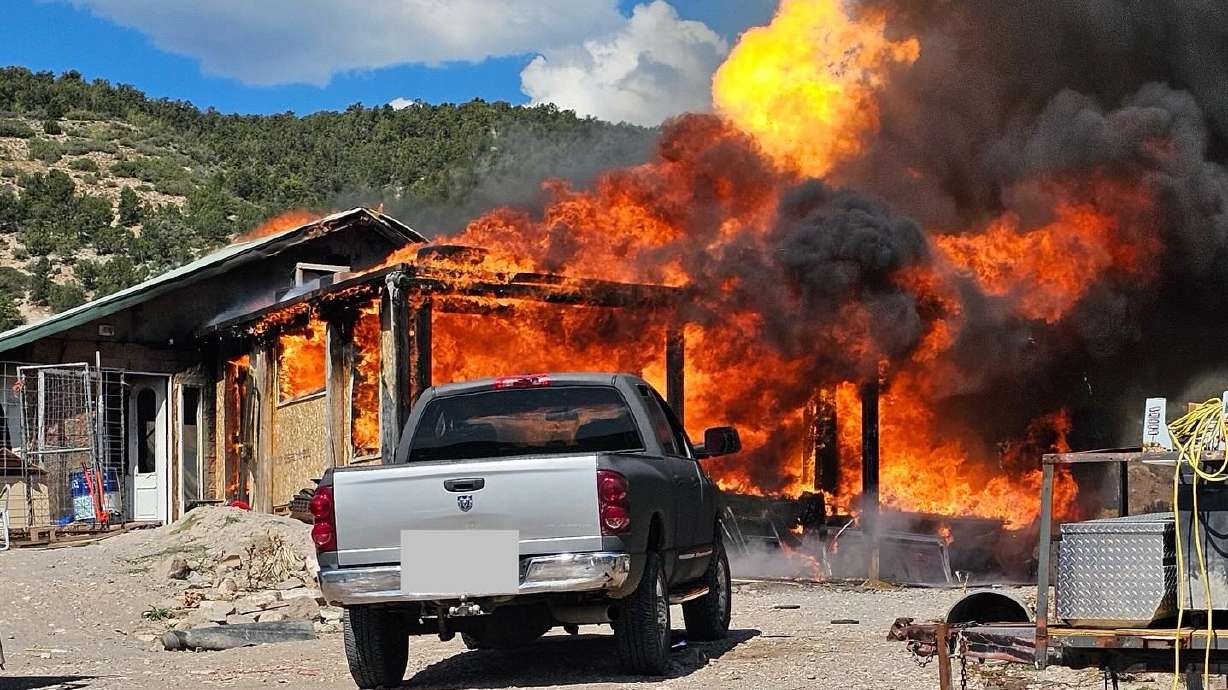 Three structures were each deemed a total loss after a house caught fire in a remote area of southern Utah on Tuesday morning.