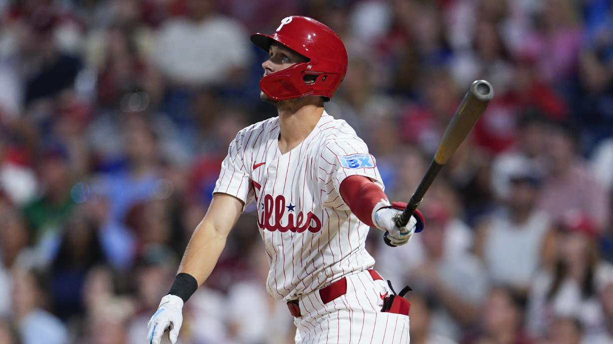 Philadelphia Phillies' Trea Turner watches his two-run home run off Tampa Bay Rays' Taj Bradley during the third inning of a baseball game, Tuesday, Sept. 10, 2024, in Philadelphia.