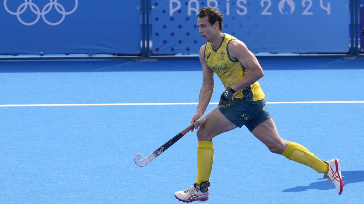 FILE - Australia's Thomas Craig runs with the ball during the men's field hockey match between Australia and New Zealand at the Yves-du-Manoir Stadium, at the 2024 Summer Olympics, Thursday, Aug. 1, 2024, in Colombes, France.