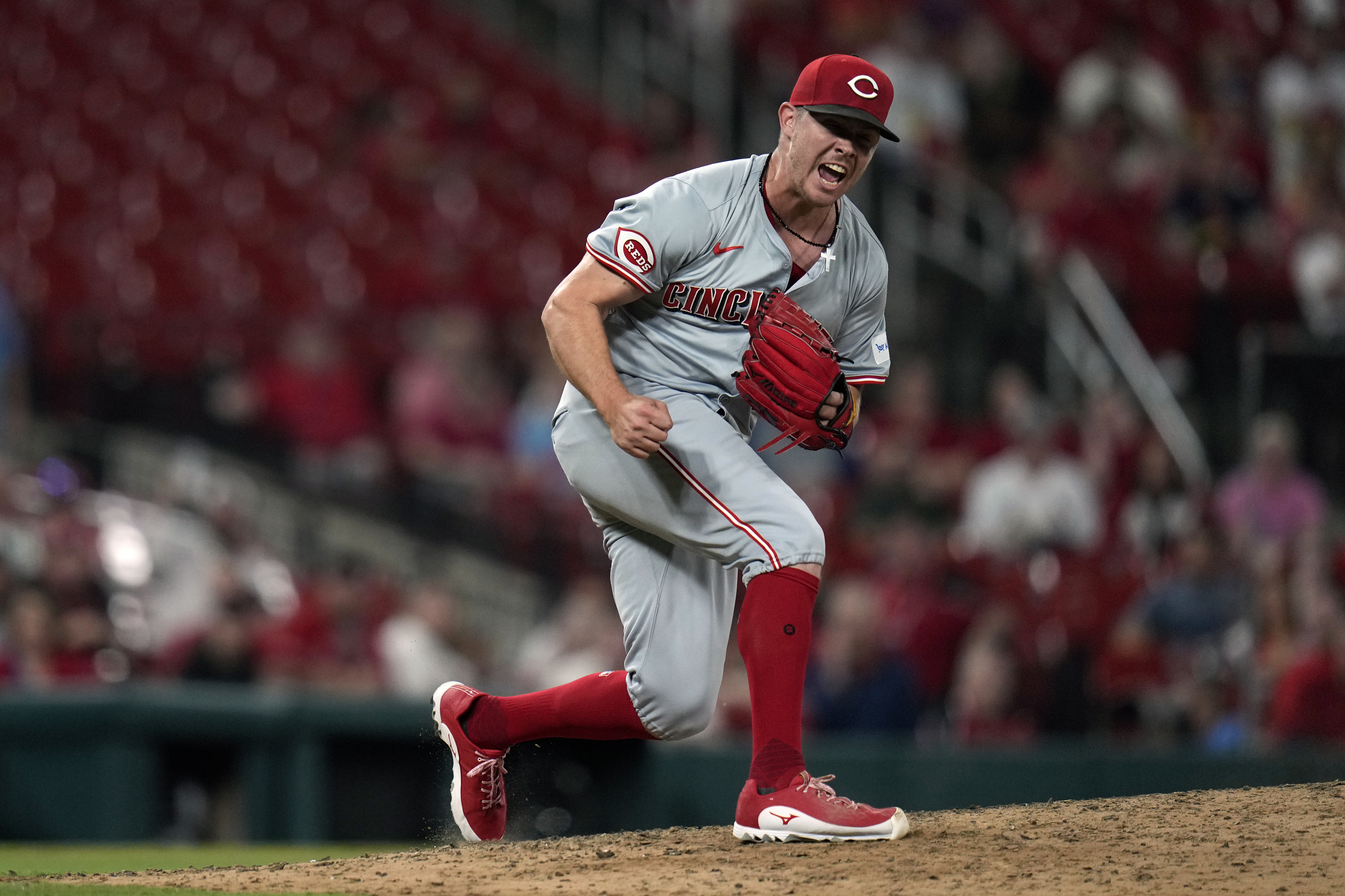 Cincinnati Reds relief pitcher Emilio Pagan celebrates after striking out St. Louis Cardinals' Matt Carpenter with the bases loaded to end a baseball game Tuesday, Sept. 10, 2024, in St. Louis. The Reds won 3-0.