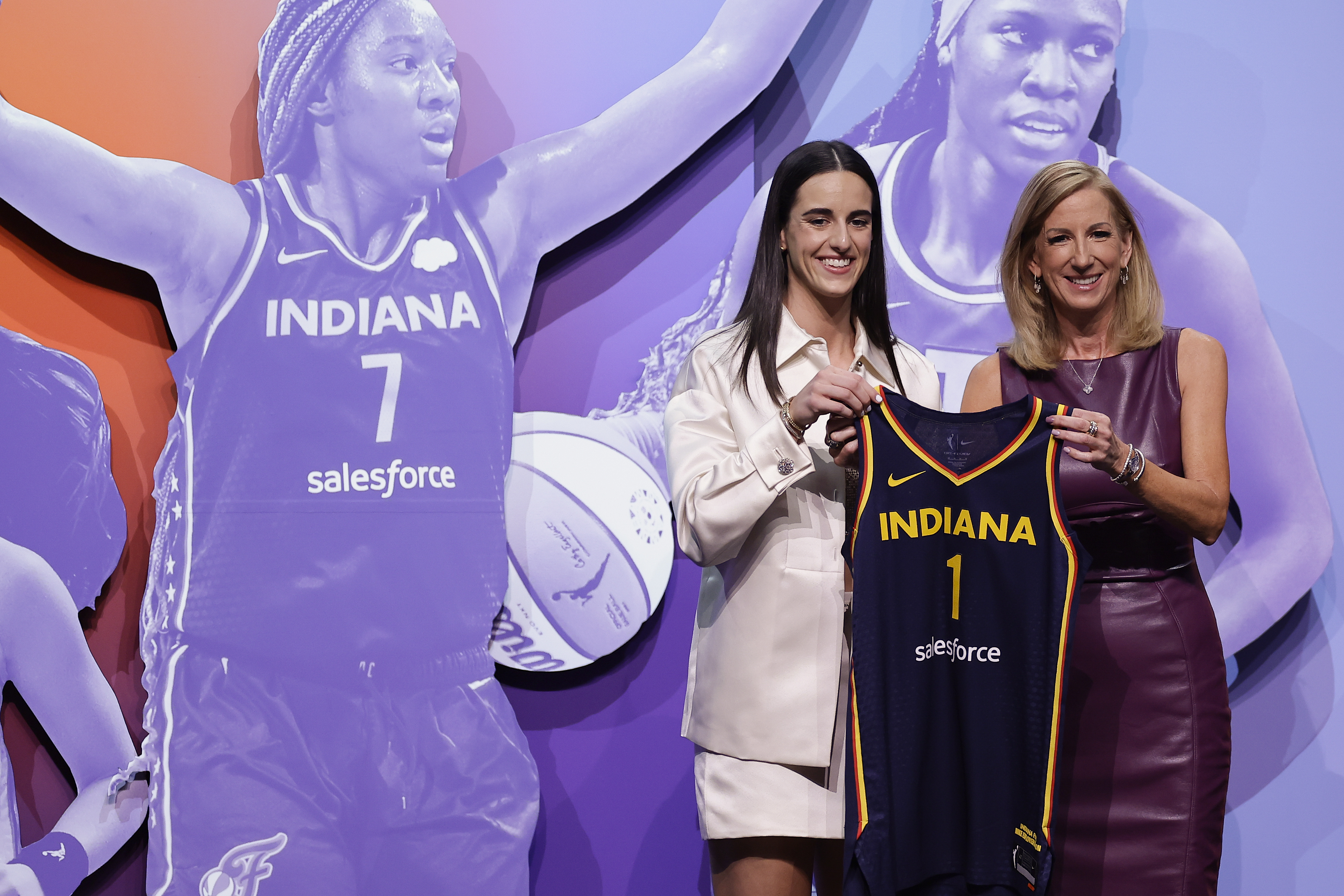 FILE - Iowa's Caitlin Clark, left, poses for a photo with WNBA commissioner Cathy Engelbert, right, after being selected first overall by the Indiana Fever during the first round of the WNBA basketball draft, April 15, 2024, in New York.