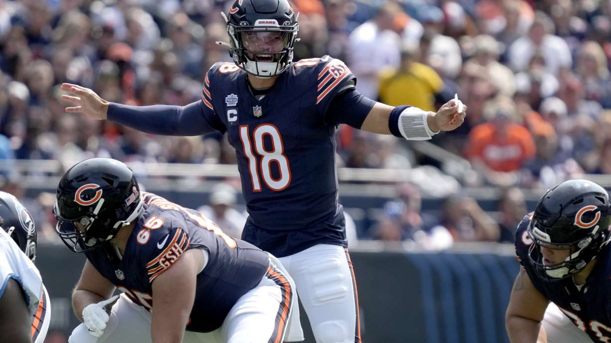 Chicago Bears quarterback Caleb Williams calls a play at the line of scrimmage during the first half of an NFL football game against the Tennessee Titans on Sunday, Sept. 8, 2024, in Chicago.