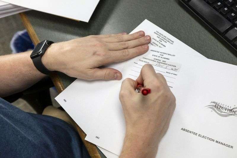 Trey Forrest, Absentee Election Coordinator for the Jefferson County/Birmingham (Ala.) Division, prepares absentee ballots for the November election, Tuesday in Birmingham, Ala.