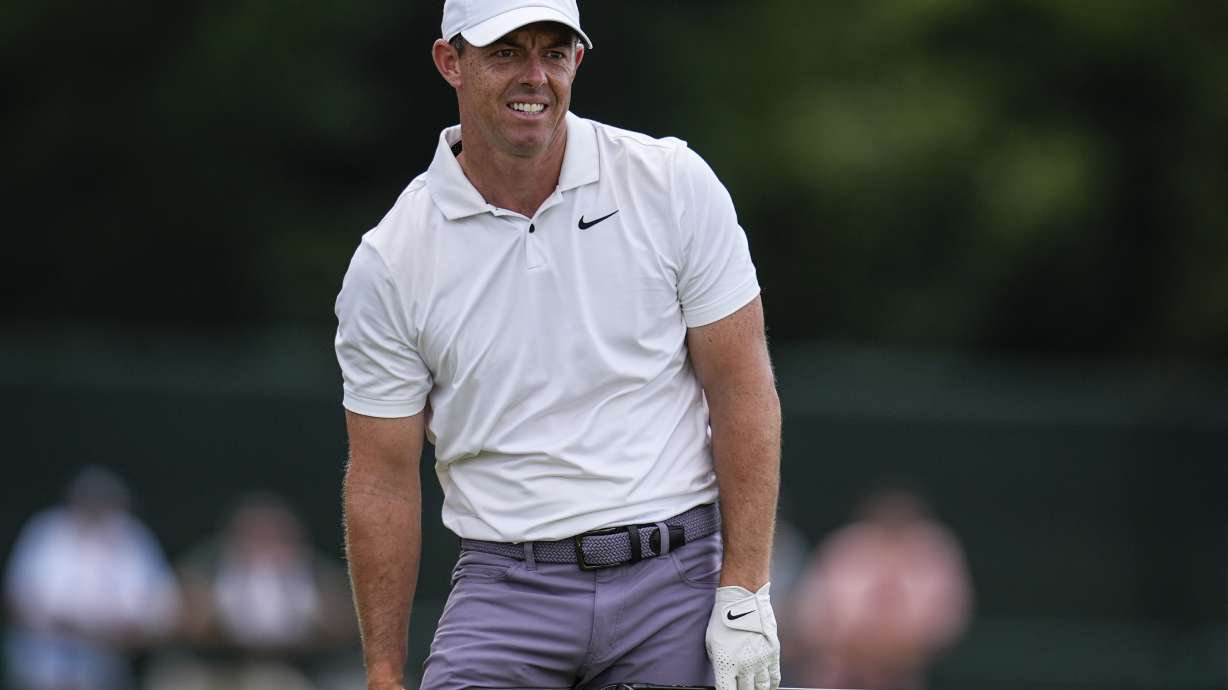 Rory McIlroy, of Northern Ireland, watches his ball on the eighth hole during the second round of the Tour Championship golf tournament, Friday, Aug. 30, 2024, in Atlanta.