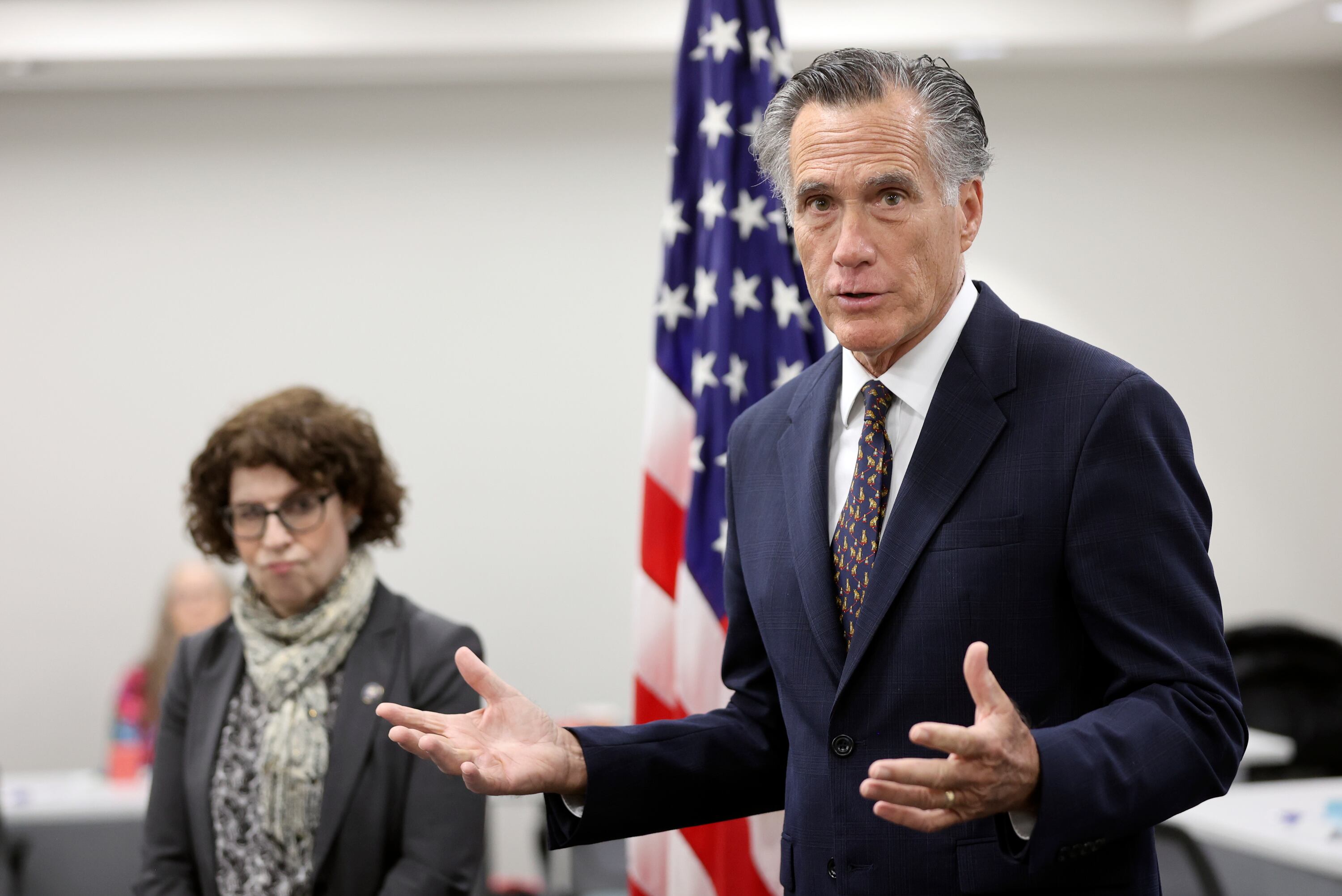 U.S. Assistant Secretary of State for Consular Affairs Rena Bitter and Sen. Mitt Romney, R-Utah, speak to members of the media while visiting the State Department’s Salt Lake City Passport Fair at the Bennett Federal Building in Salt Lake City on Feb. 16.