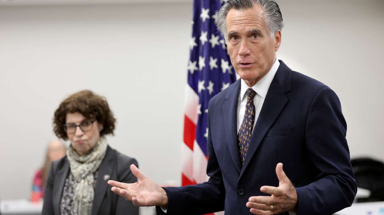 U.S. Assistant Secretary of State for Consular Affairs Rena Bitter and Sen. Mitt Romney, R-Utah, speak to members of the media while visiting the State Department’s Salt Lake City Passport Fair at the Bennett Federal Building in Salt Lake City on Feb. 16.