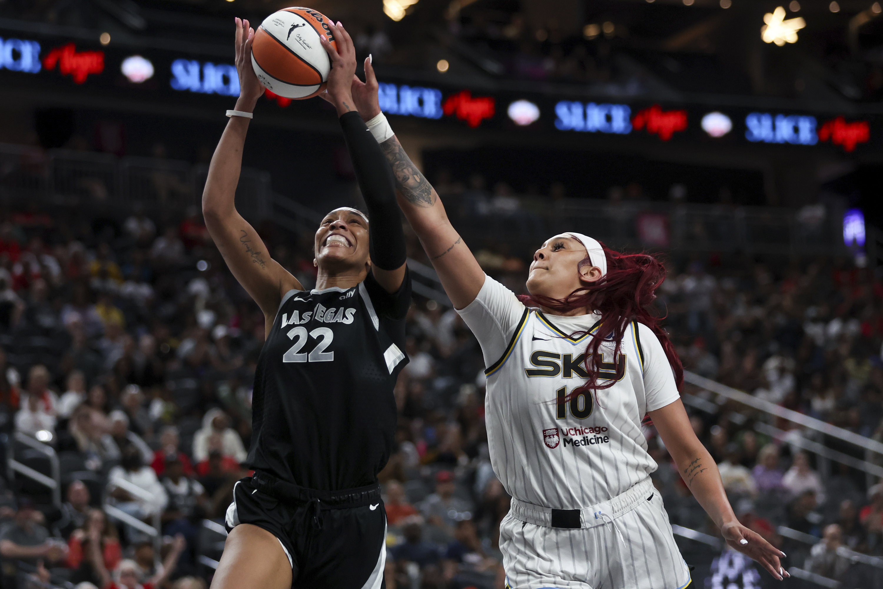 Las Vegas Aces center A'ja Wilson (22) shoots and is fouled by Chicago Sky center Kamilla Cardoso (10) during the second half of an WNBA basketball game, Tuesday, Sept. 3, 2024, in Las Vegas. L