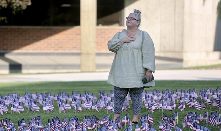 Amy Barnett holds her hand over her heart during a flag ceremony to honor the victims of the Sept. 11 terrorist attacks at Utah Valley University in Orem on Wednesday.