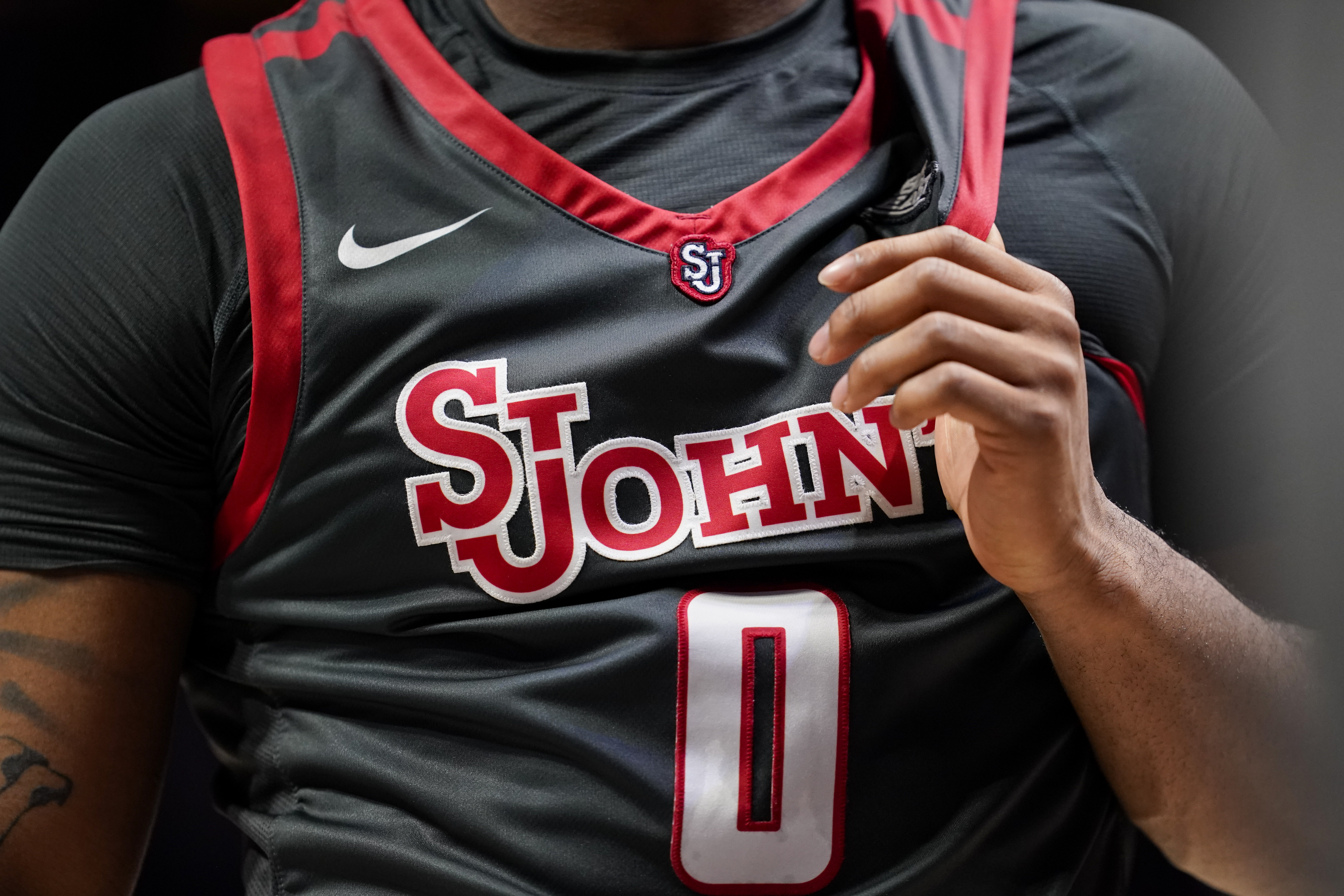 FILE - St. John's Posh Alexander (0) holds onto his jersey during a stoppage in play in the second half of an NCAA college basketball game against Xavier, Feb. 4, 2023, in Cincinnati.