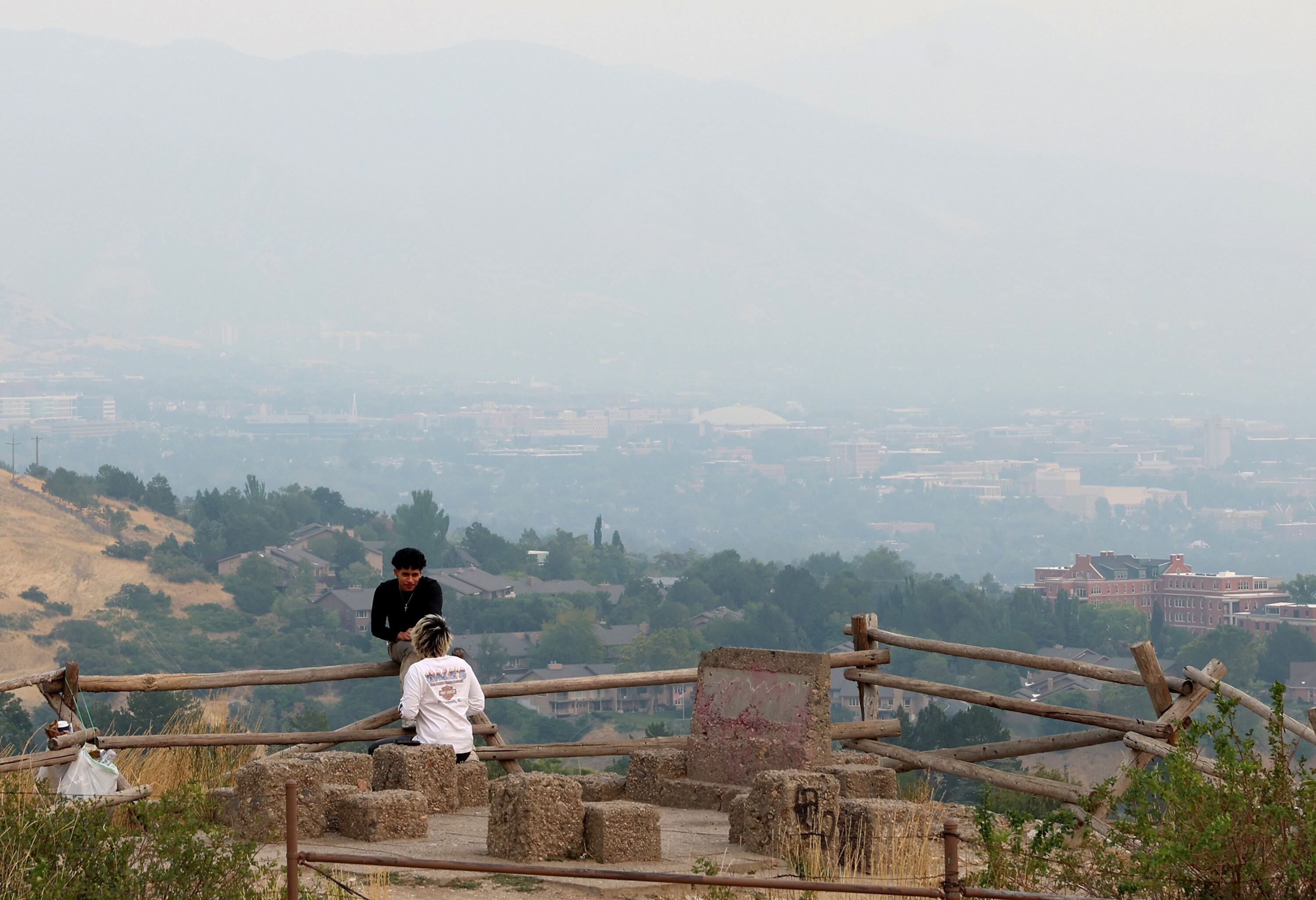 The Wasatch Mountains are barely visible from Ensign Peak in Salt Lake City on Wednesday. Smoke from three major wildfires in Southern California blew into Utah Wednesday, causing air quality to plummet as the sky filled with haze.