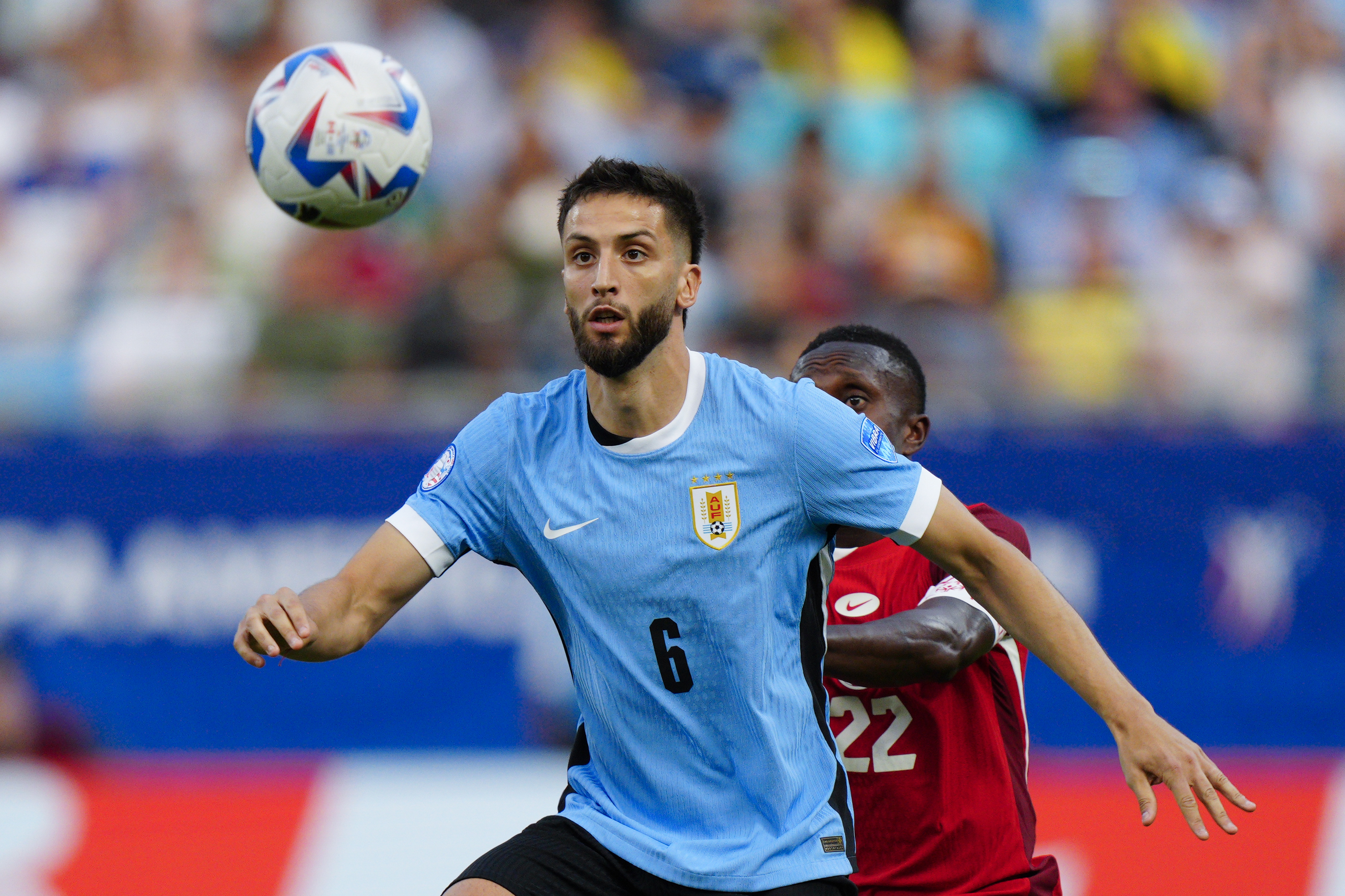 FILE - Uruguay's Rodrigo Bentancur eyes the ball challenged by Canada's Richie Laryea during the Copa America third place soccer match in Charlotte, N.C., July 13, 2024.