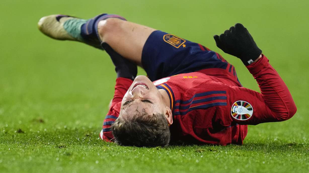 FILE - Spain's Gavi Paez reacts after injuring his leg during the Euro 2024 group A qualifying soccer match between Spain and Georgia at Jose Zorrilla Stadium in Valladolid, Spain, Nov. 19 23, 2023.