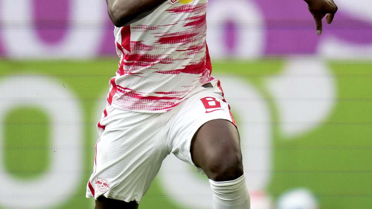 FILE - Leipzig's Amadou Haidara plays the ball during the German Bundesliga soccer match between VfL Wolfsburg and RB Leipzig in Wolfsburg, Germany, Aug. 29, 2021.