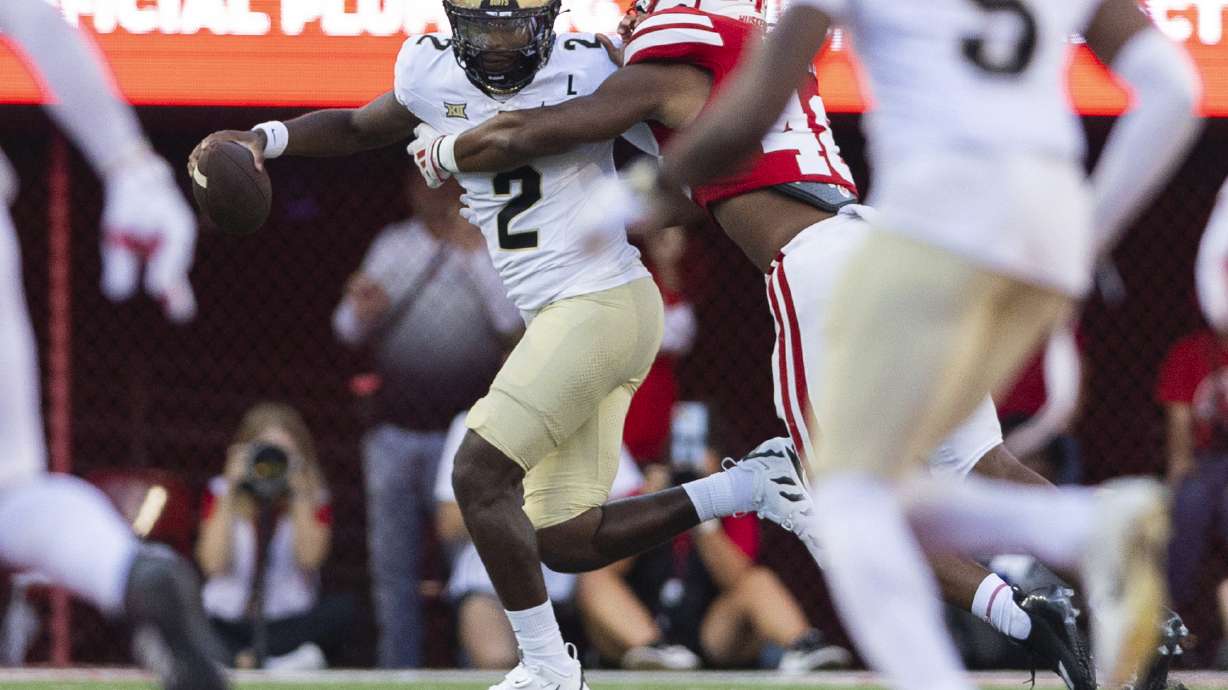 FILE - Nebraska linebacker MJ Sherman, back right, tackles Colorado quarterback Shedeur Sanders (2) during the first half of an NCAA college football game Sept. 7, 2024, in Lincoln, Neb.
