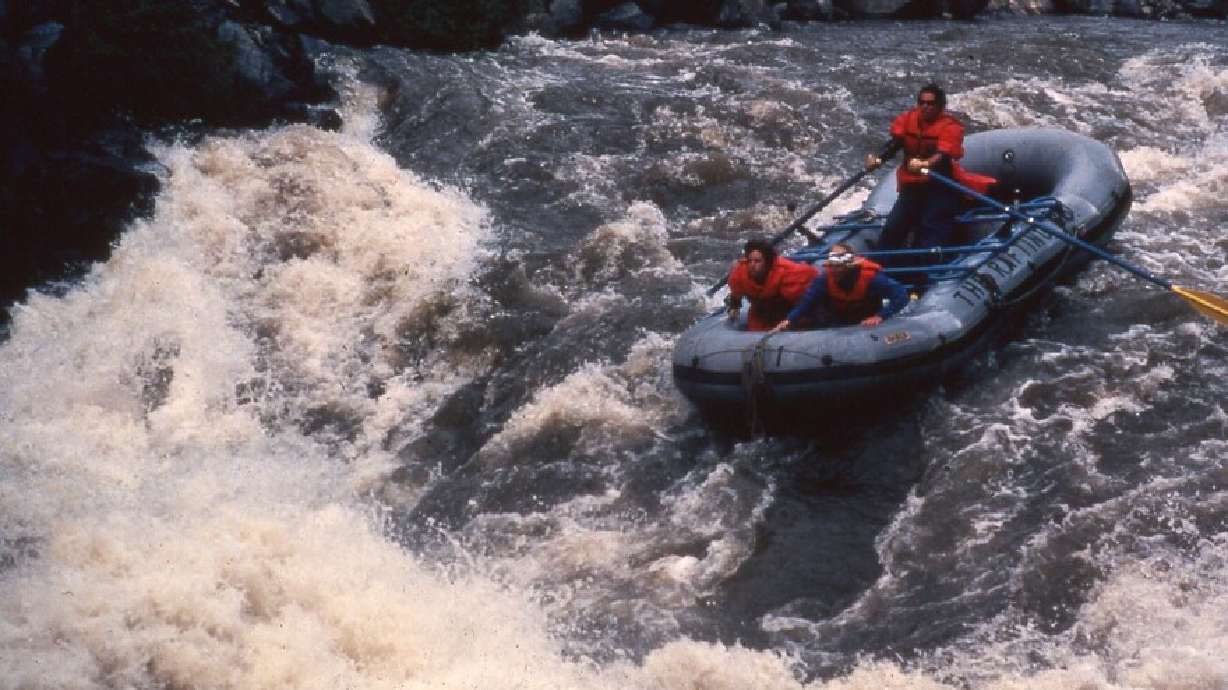 Three rafters face rapids in Byers Canyon in Colorado in this undated image. A group of women have come together each year for decades to raft western rivers.