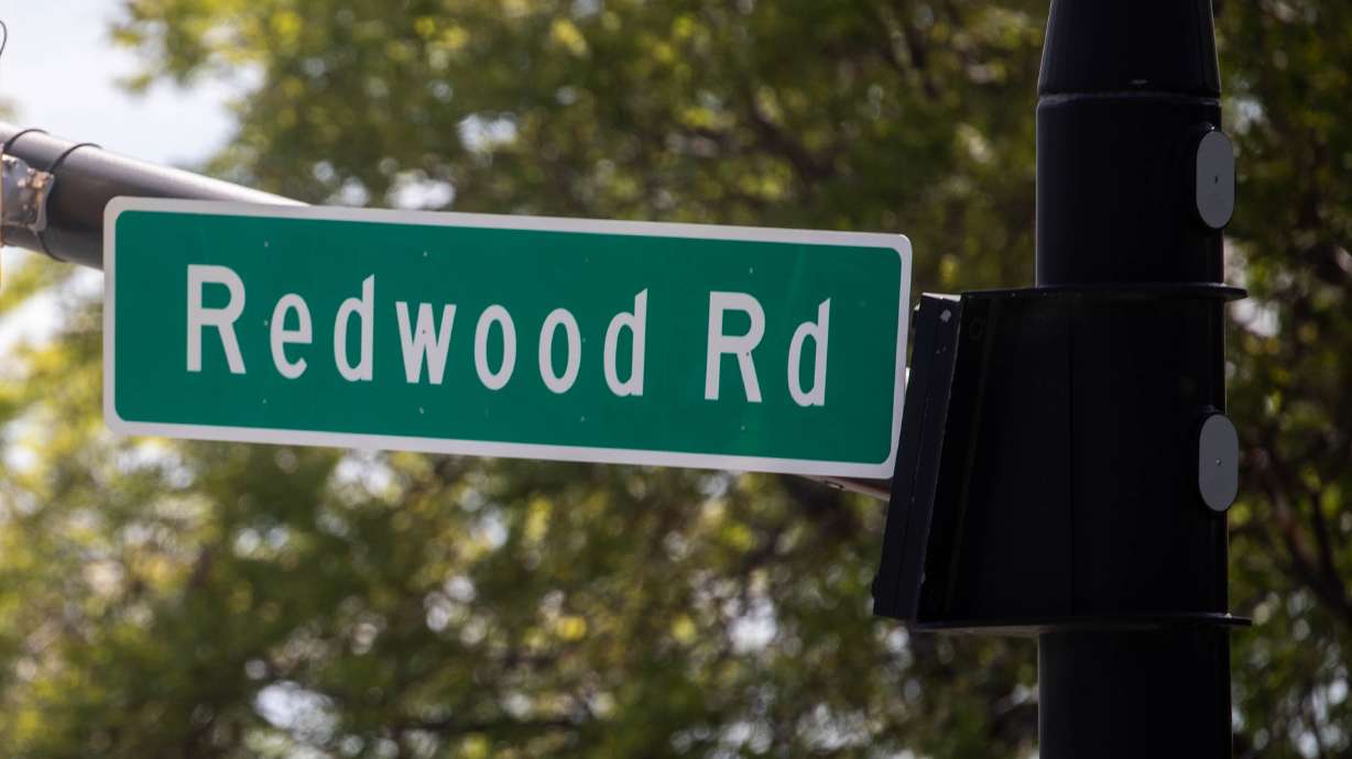 A Redwood Road sign is pictured in Salt Lake City on May 6, 2021. Salt Lake City received a nearly $3 million federal grant to help construct ways to make the road safer for bikers and pedestrians.