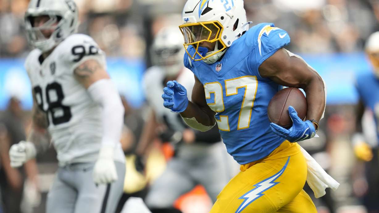 Los Angeles Chargers running back J.K. Dobbins (27) runs against the Las Vegas Raiders during the second half of an NFL football game, Sunday, Sept. 8, 2024, in Inglewood, Calif.