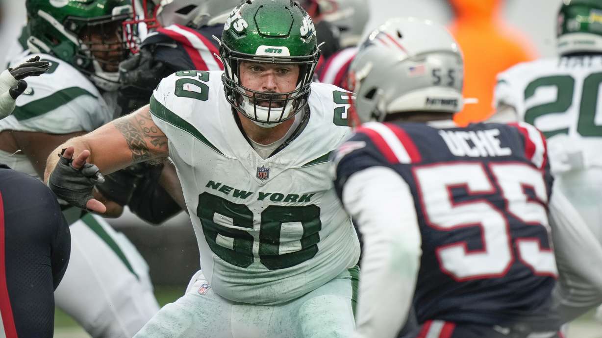 FILE - New York Jets center Connor McGovern (60) blocks at the line of scrimmage during the second half an NFL football game against the New England Patriots, Sept. 24, 2023, in New York.