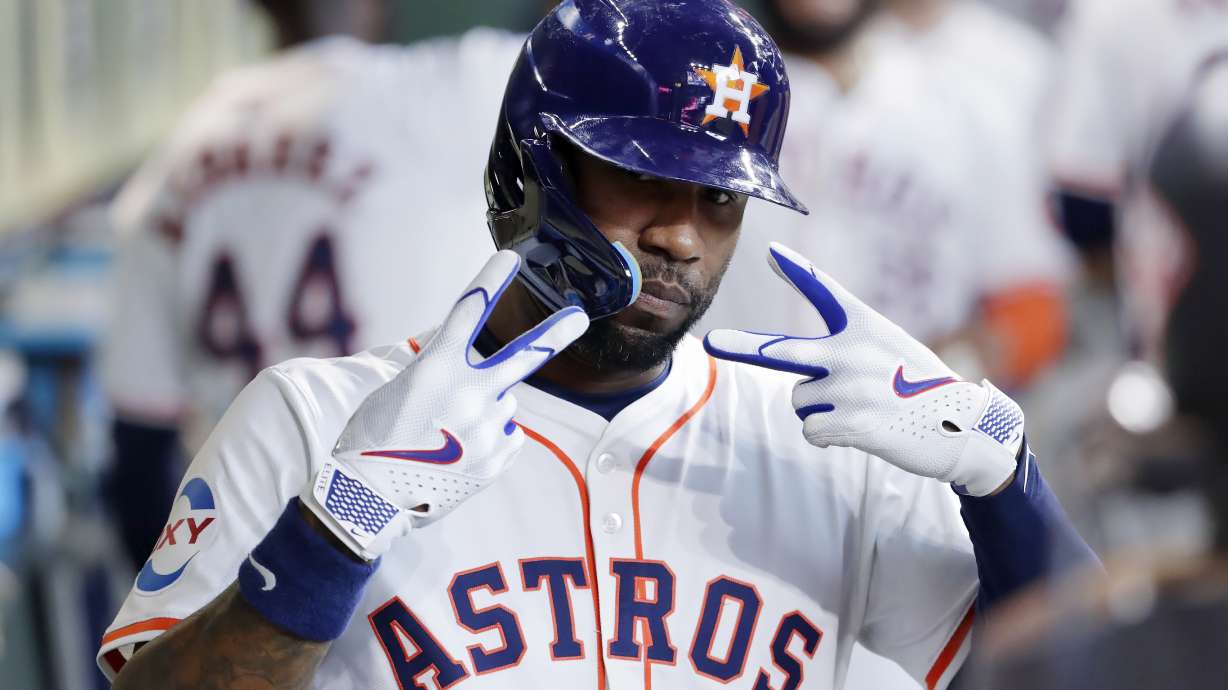Houston Astros' Jason Heyward mugs for the dugout camera as he celebrates his two-run home run against the Oakland Athletics during the second inning of a baseball game Thursday, Sept. 12, 2024, in Houston.