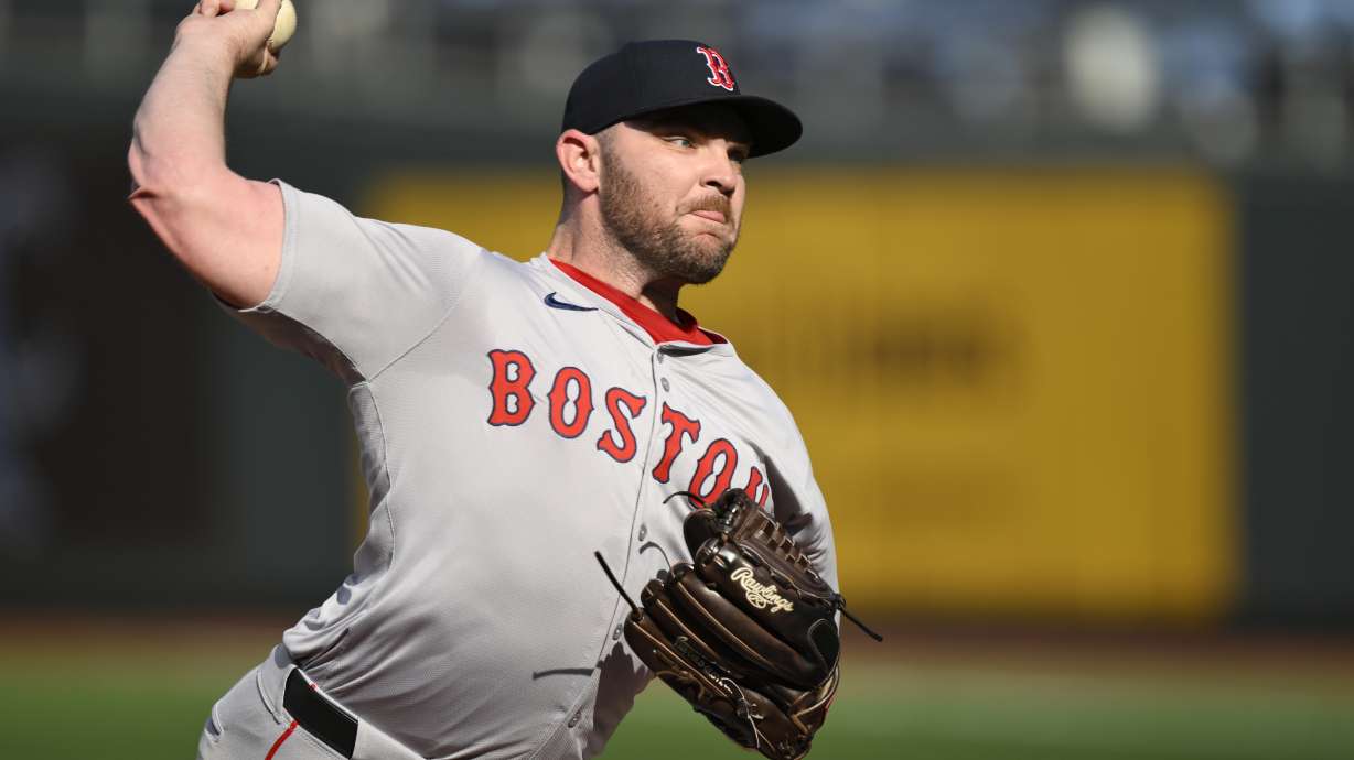 FILE - Boston Red Sox pitcher Liam Hendriks throws during warmups before a baseball game against the Kansas City Royals, Aug. 6, 2024, in Kansas City, Mo.
