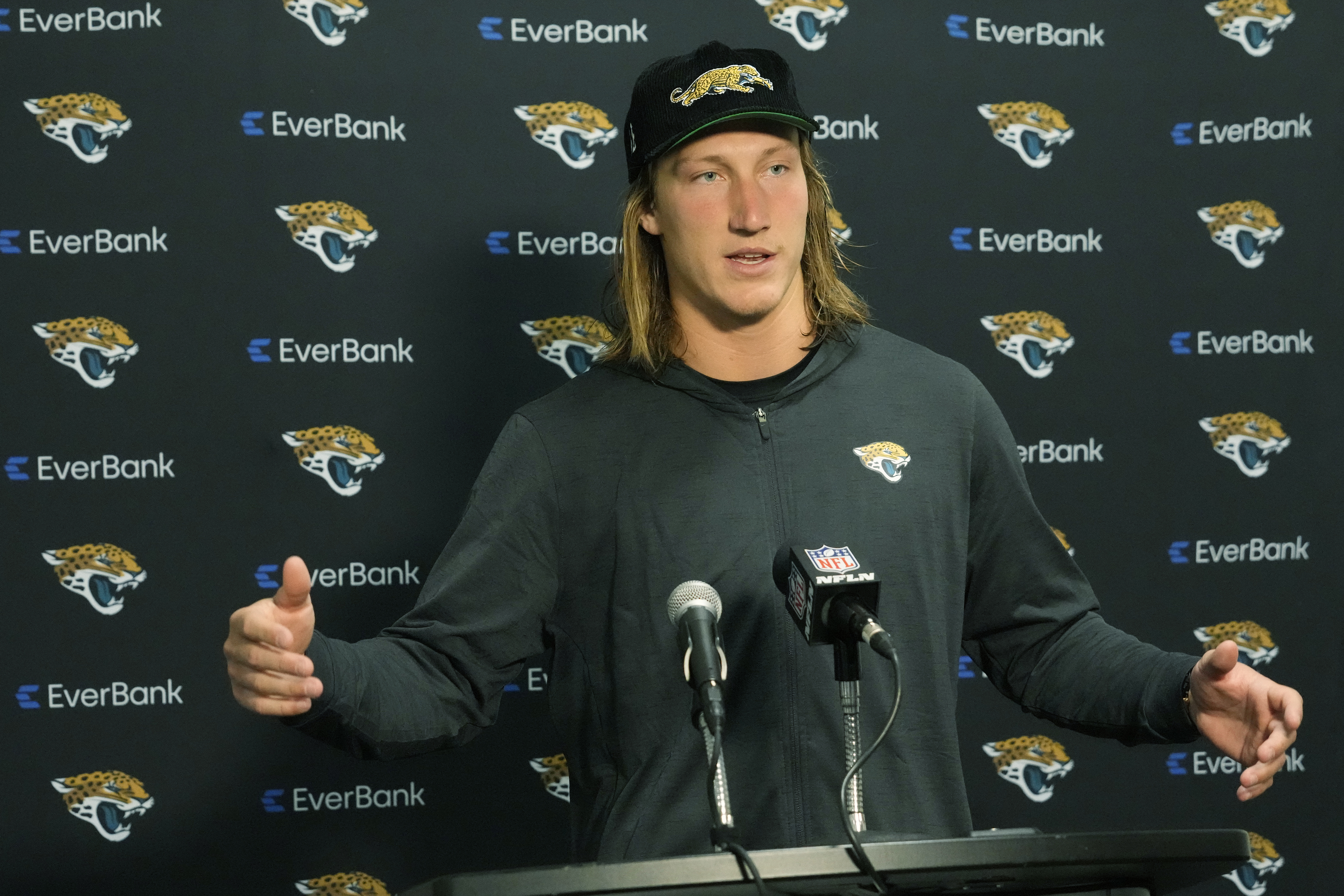 Jacksonville Jaguars quarterback Trevor Lawrence gestures during a post game NFL football news conference, Sunday, Sept. 8, 2024, in Miami Gardens, Fla. The Dolphins defeated the Jaguars 20-17.