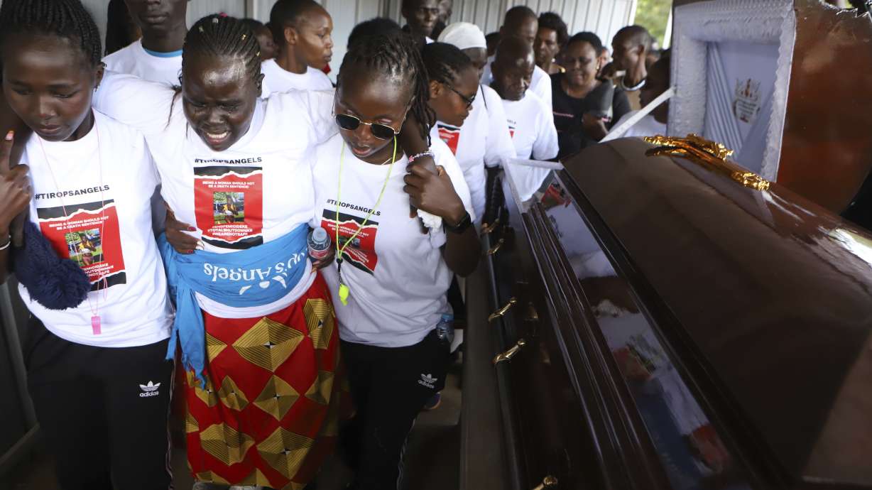Relatives try to comfort a woman crying after viewing the body of Ugandan Olympic athlete Rebecca Cheptegei at Moi Teaching and Referral Hospital morgue in the western city of Eldoret, in Rift Valley, Kenya Friday, Sept. 13, 2024.