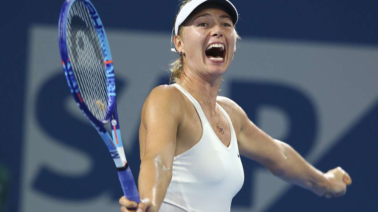 FILE - Maria Sharapova of Russia celebrates after she won the women's final match against Ana Ivanovic of Serbia during the Brisbane International tennis tournament in Brisbane, Australia, Jan. 10, 2015.