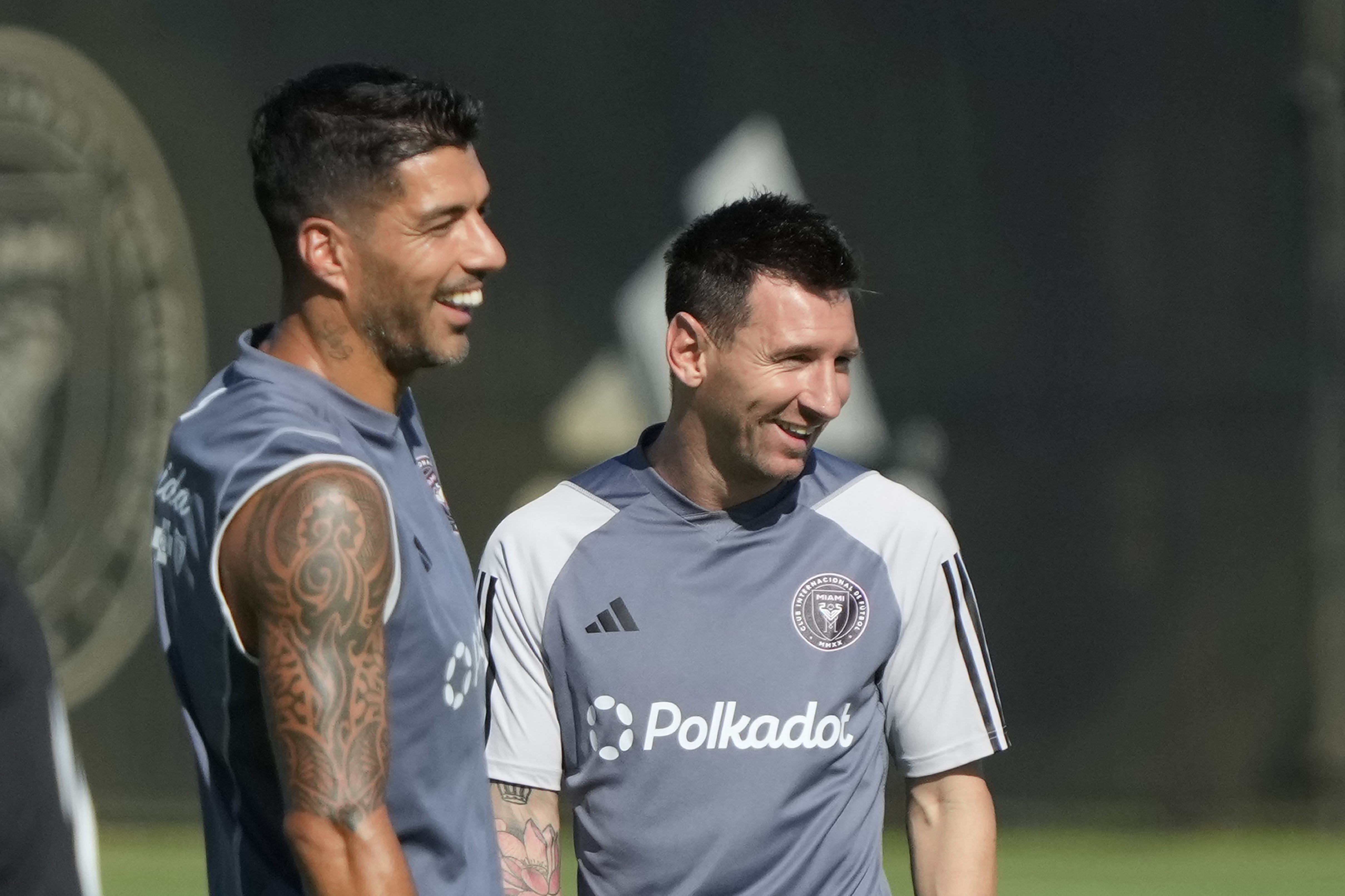 Inter Miami forwards Lionel Messi, right, and Luis Suarez, share a laugh as the work out at the MLS soccer team's training facility, Friday, Sept. 13, 2024, in Fort Lauderdale, Fla.