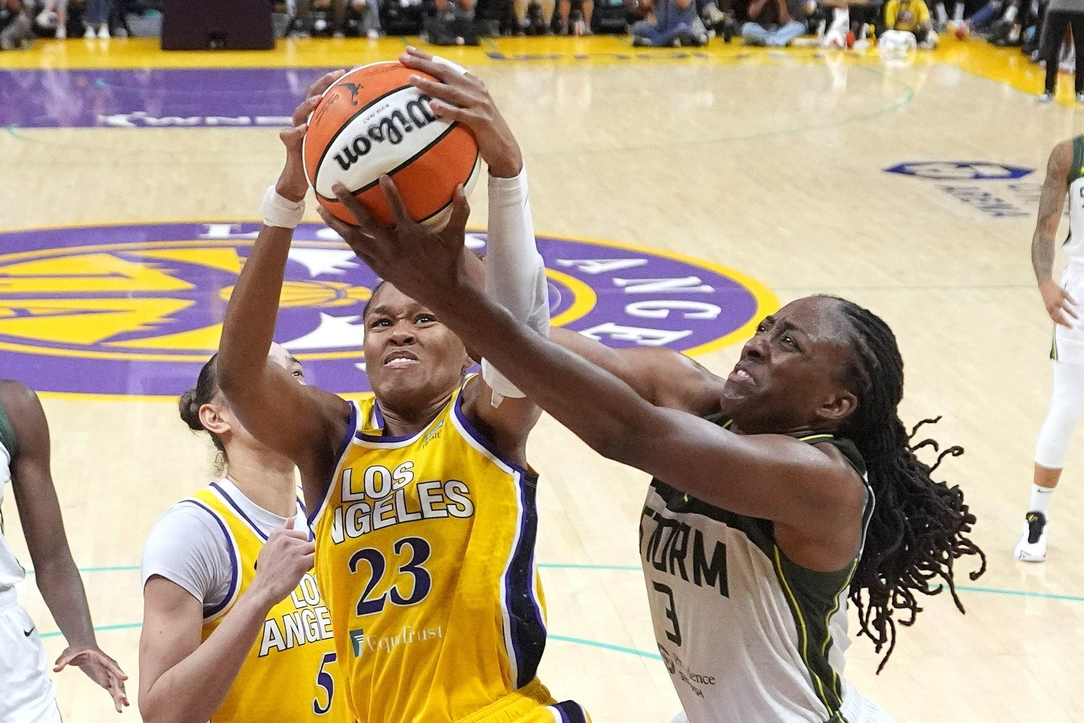 Los Angeles Sparks forward Azura Stevens, left, and Seattle Storm forward Nneka Ogwumike go after a rebound during the second half of a WNBA basketball game, Wednesday, Sept. 11, 2024, in Los Angeles.