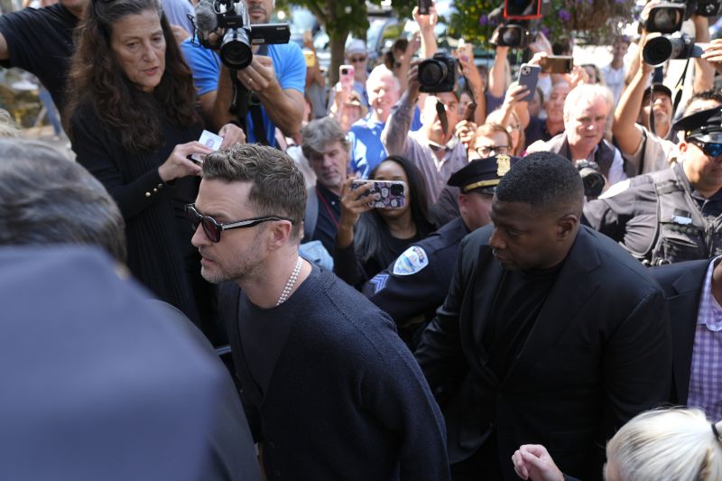 Justin Timberlake, left, walks into court for a hearing, Friday in Sag Harbor, N.Y.