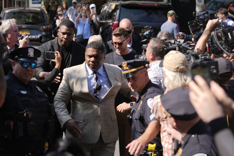 Justin Timberlake, center, walks into court for a hearing, Friday, in Sag Harbor, N.Y.