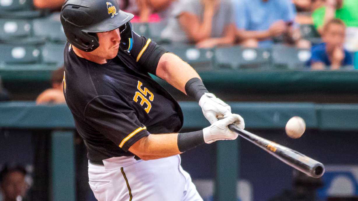Salt Lake Bees catcher Chad Wallach swings at a pitch during a game at Smith's Ballpark on July 28. The Bees will sport a helmet logo on their their uniform for the first time beginning next year.
