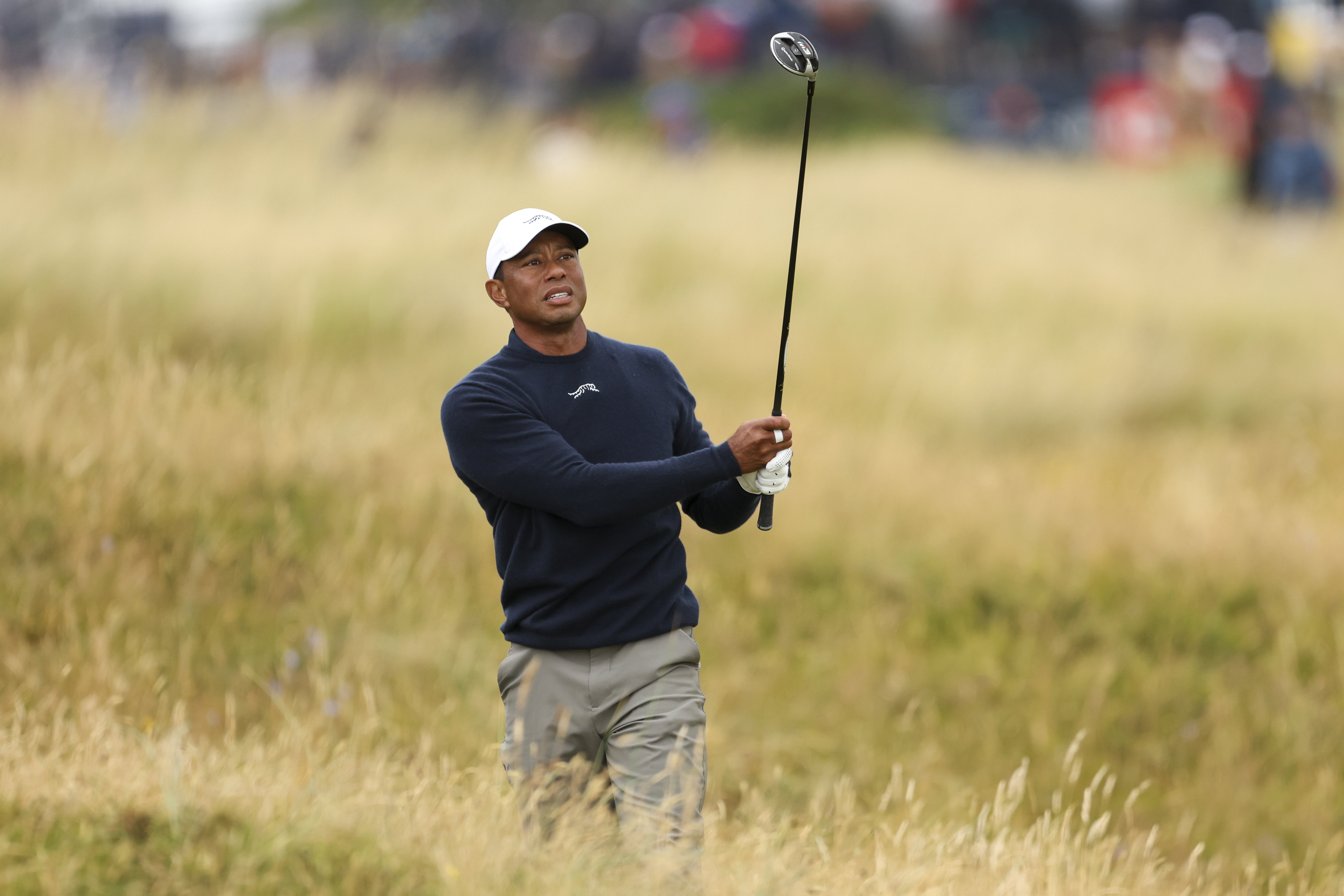 FILE - Tiger Woods of the United States plays from the rough on the sixth hole during his second round of the British Open Golf Championships at Royal Troon golf club in Troon, Scotland, July 19, 2024.