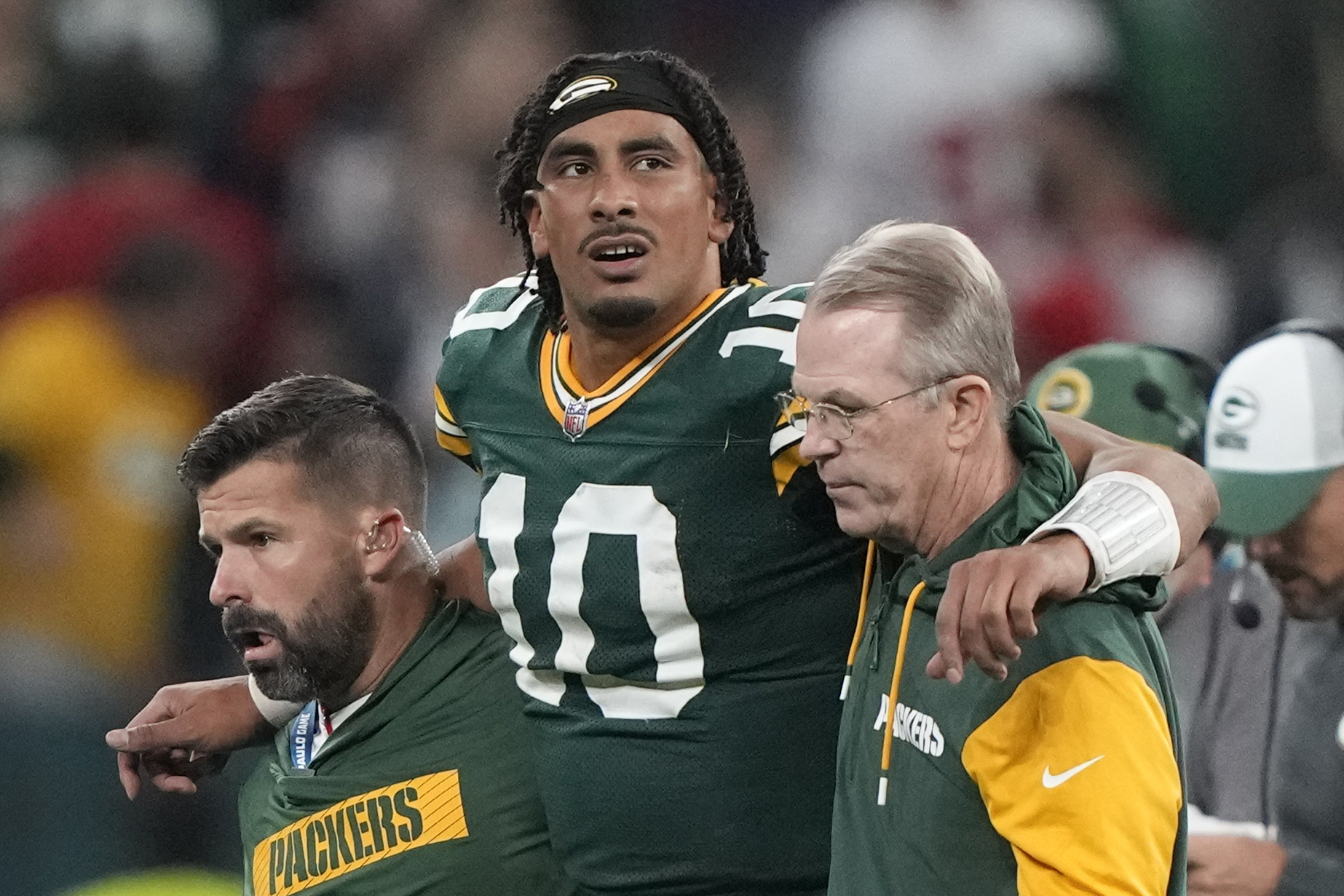 Green Bay Packers quarterback Jordan Love (10) in helped off the field after getting hurt during the second half of an NFL football game against the Philadelphia Eagles, Saturday, Sept. 7, 2024, at the Neo Quimica Arena in Sao Paulo.