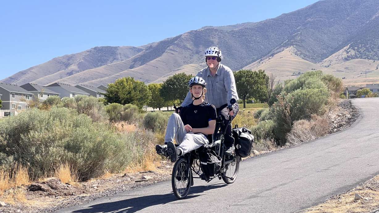 Josh and James Taylor train on the Hase Pino tandem bike on July 12. Josh Taylor is embarking on a statewide tour on the bike, during which he wants to see the world "through your eyes."