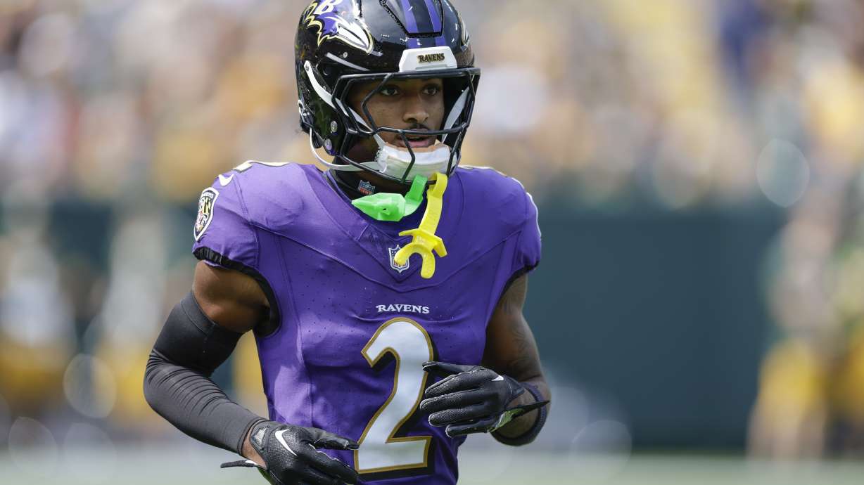 FILE - Baltimore Ravens cornerback Nate Wiggins (2) warms up during an NFL football game between the Green Bay Packers and Baltimore Ravens, Aug. 24, 2024, in Green Bay, Wis.