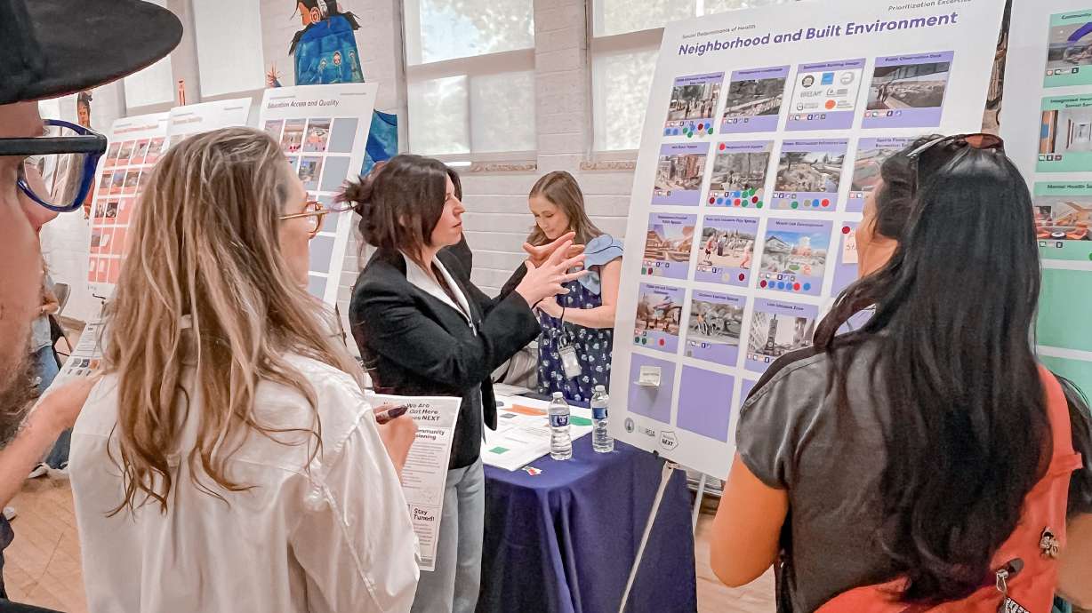 Lauren Parisi, a senior project manager with the Redevelopment Agency of Salt Lake City, speaks with residents and business owners about future plans for Smith's Ballpark during a public meeting at the Urban Indian Center on Thursday.