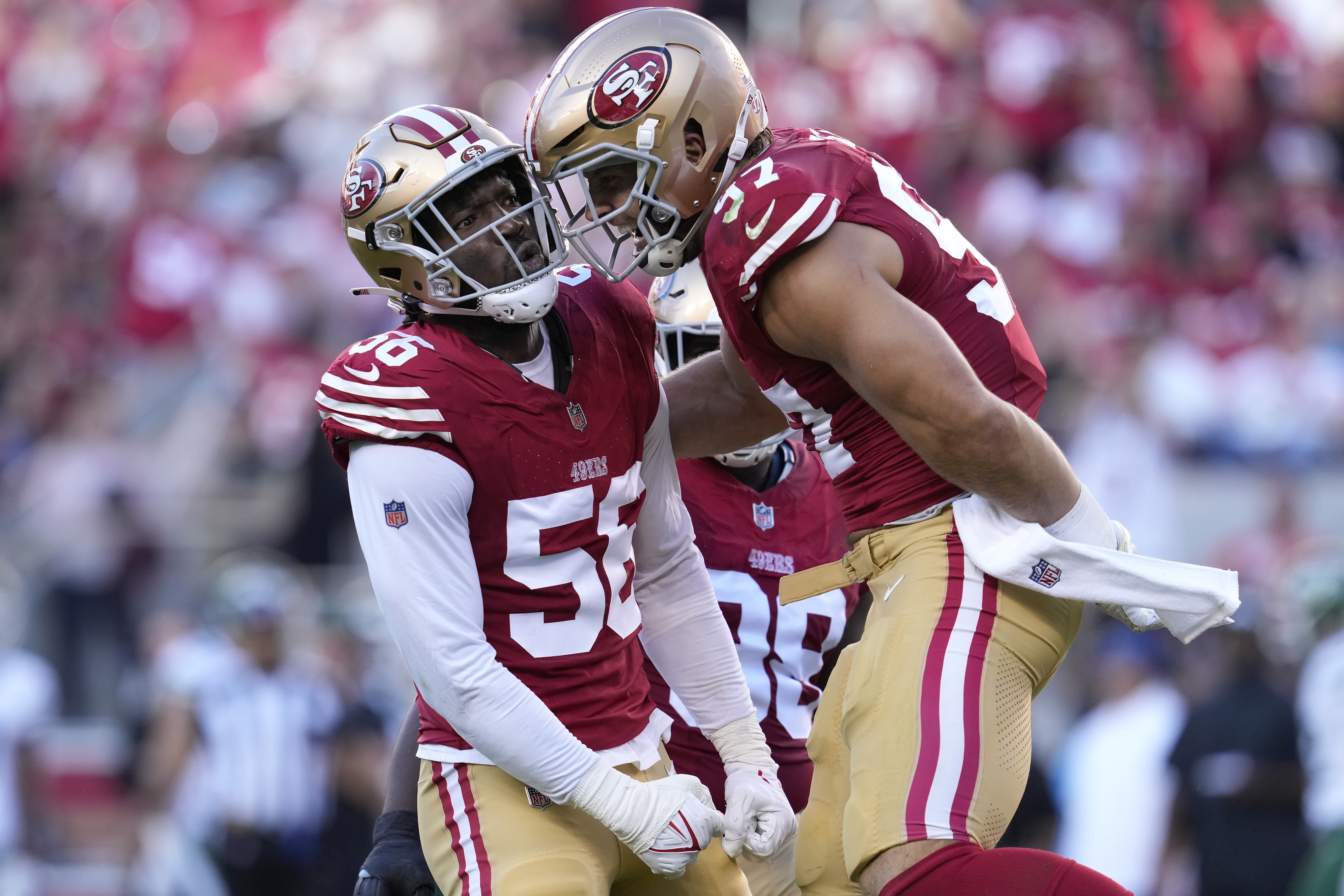 San Francisco 49ers defensive end Leonard Floyd is congratulated by defensive end Nick Bosa after sacking New York Jets quarterback Aaron Rodgers during the first half of an NFL football game in Santa Clara, Calif., Monday, Sept. 9, 2024.