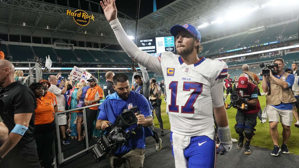 Buffalo Bills quarterback Josh Allen (17) acknowledges cheers from fans at the end of an NFL football game against the Miami Dolphins, Thursday, Sept. 12, 2024, in Miami Gardens, Fla.