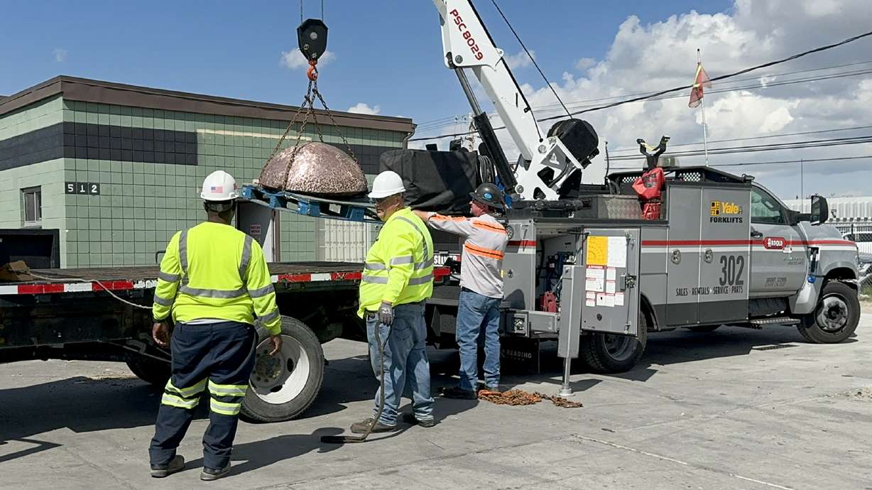 Crews load recovered copper into a truck after the Salt Lake County Sheriff's Office says it was stolen from the Kennecott mine. In all, deputies recovered $147,000 in stolen copper and arrested five people.