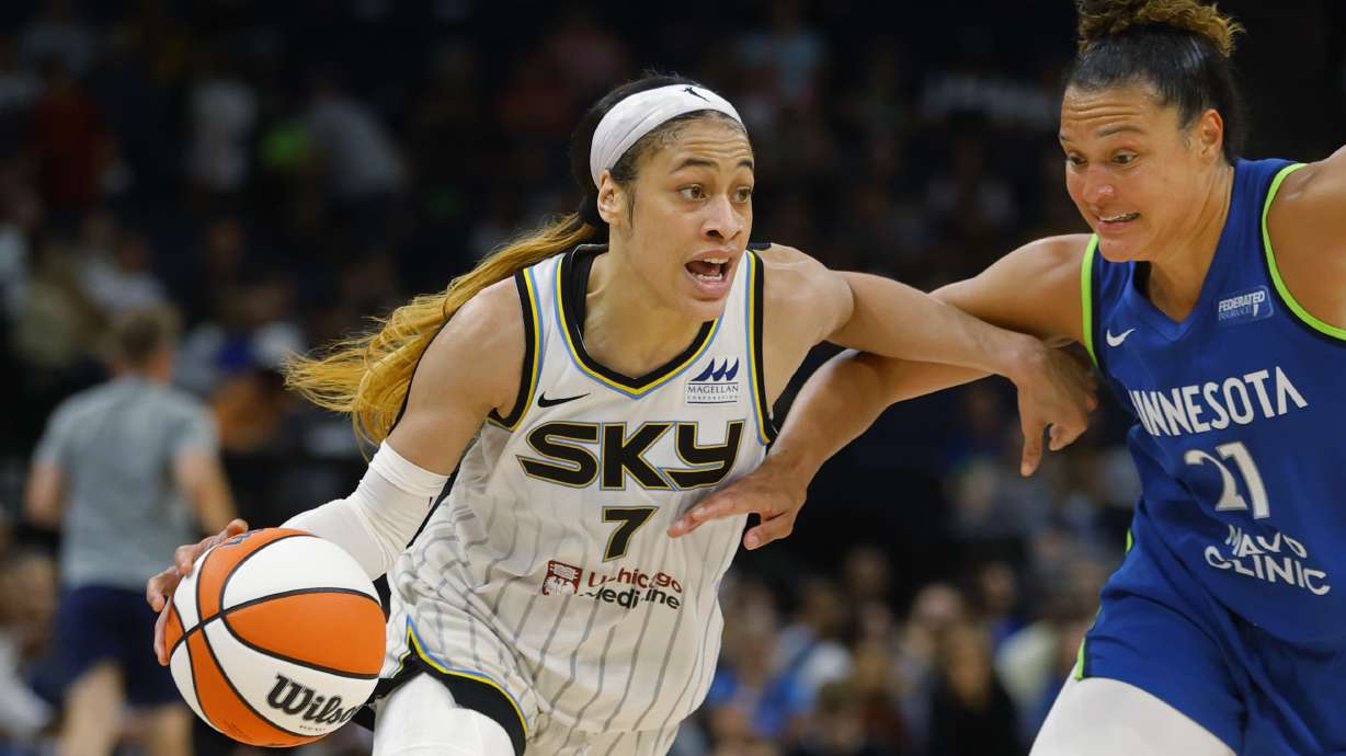 Chicago Sky guard Chennedy Carter (7) works around Minnesota Lynx guard Kayla McBride (21) in the third quarter of a WNBA basketball game Friday, Sept. 13, 2024, in Minneapolis.