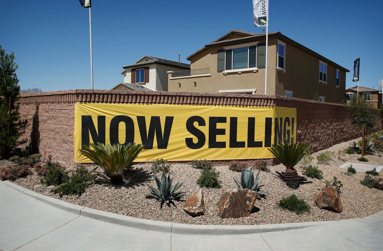 In this April 13, 2015 file photo, a sign advertises homes for sale in Las Vegas.