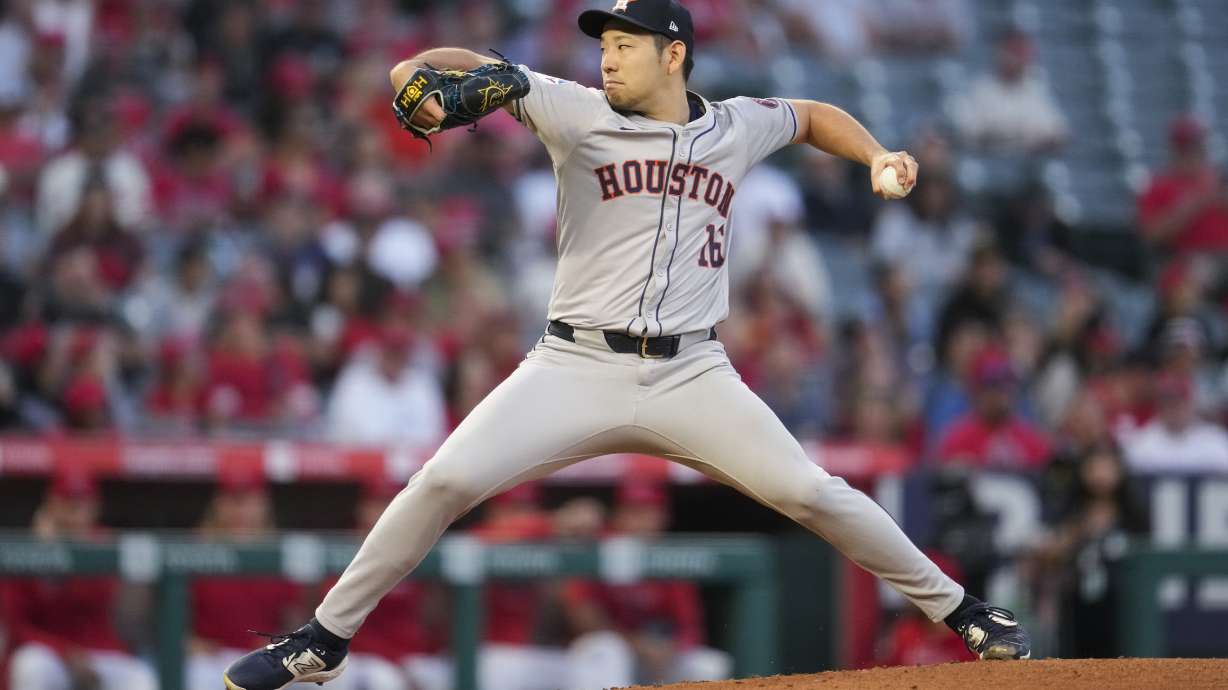 Houston Astros starting pitcher Yusei Kikuchi throws during the first inning of a baseball game against the Los Angeles Angels in Anaheim, Calif., Friday, Sept. 13, 2024.