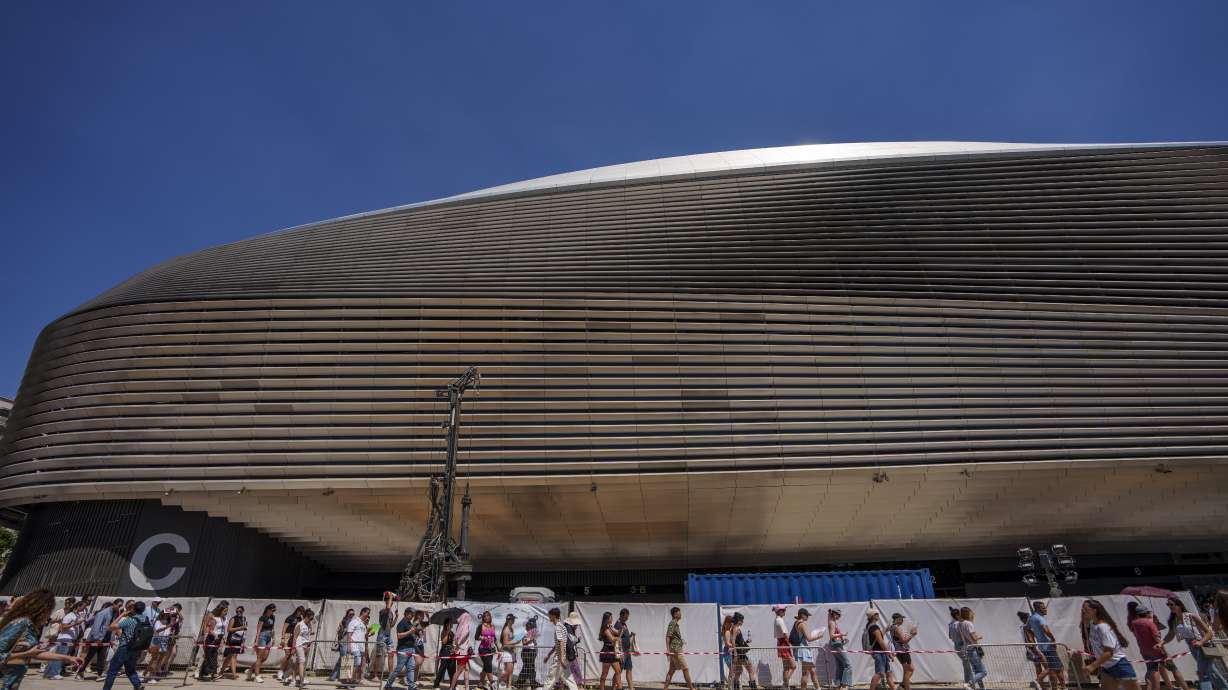 FILE - Fans of U.S. singer Taylor Swift queue to enter her concert, outside Santiago Bernabeu stadium in Madrid, Spain, May 29, 2024.