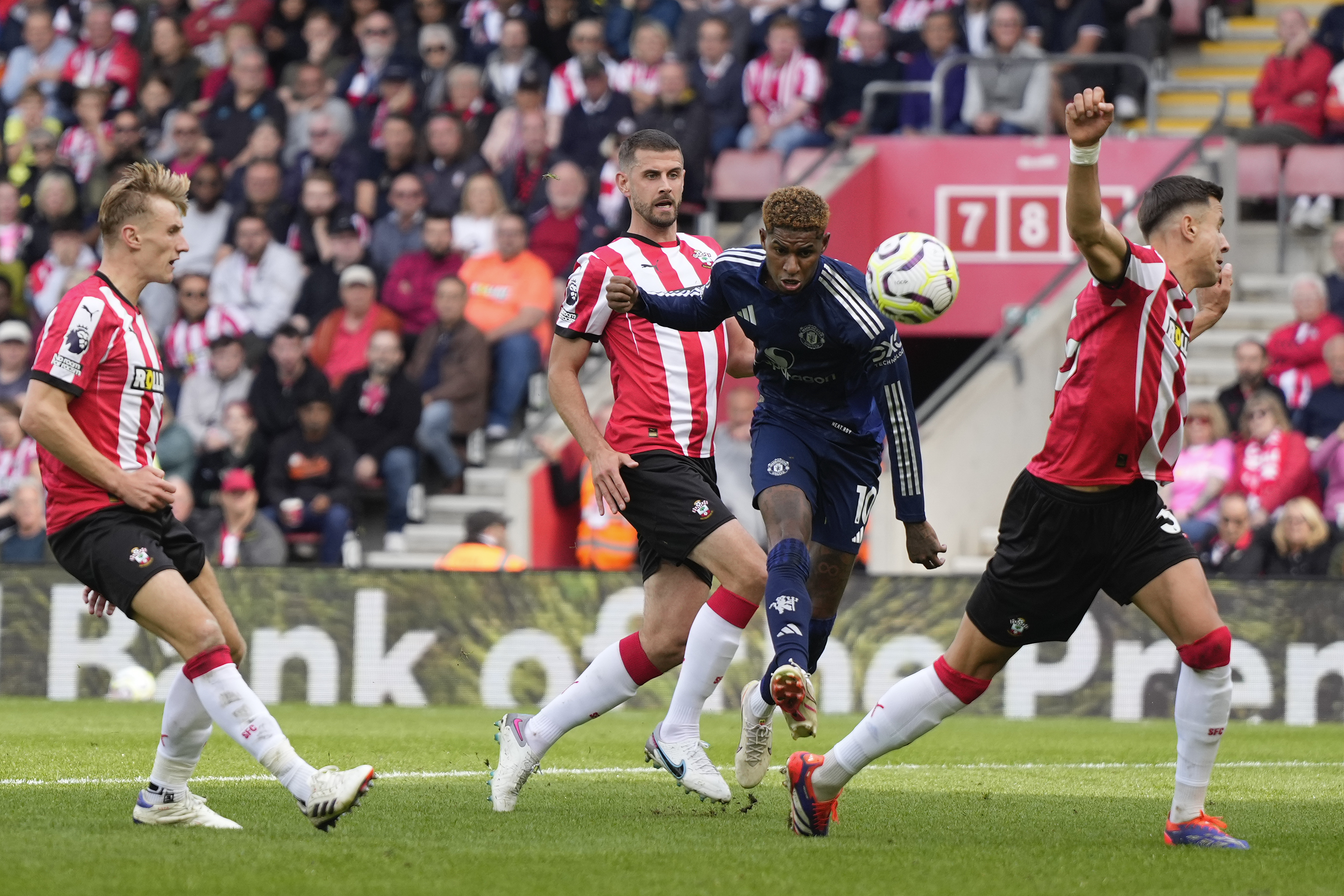 Manchester United's Marcus Rashford, center, takes a shot during the English Premier League soccer match between Southampton and Manchester United at St. Mary's stadium in Southampton, England, Saturday, Sept. 14, 2024.