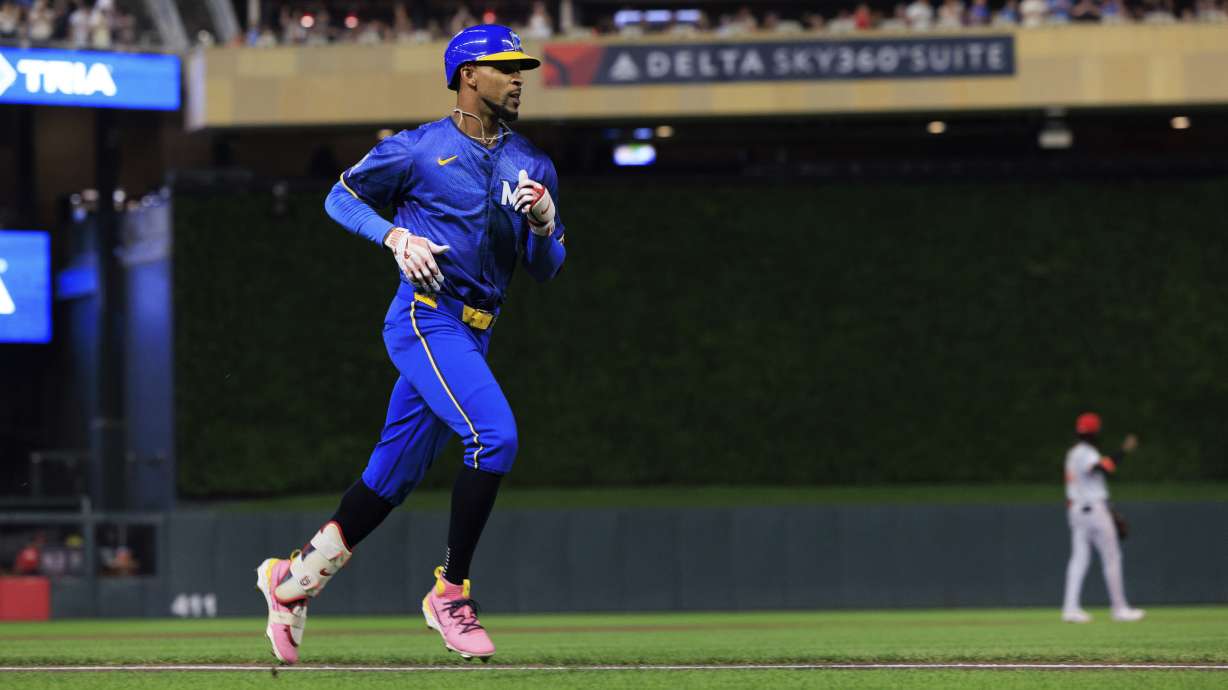 Minnesota Twins' Byron Buxton runs the bases after hitting a solo home run during the fifth inning of a baseball game against the Cincinnati Reds, Friday, Sept. 13, 2024, in Minneapolis.