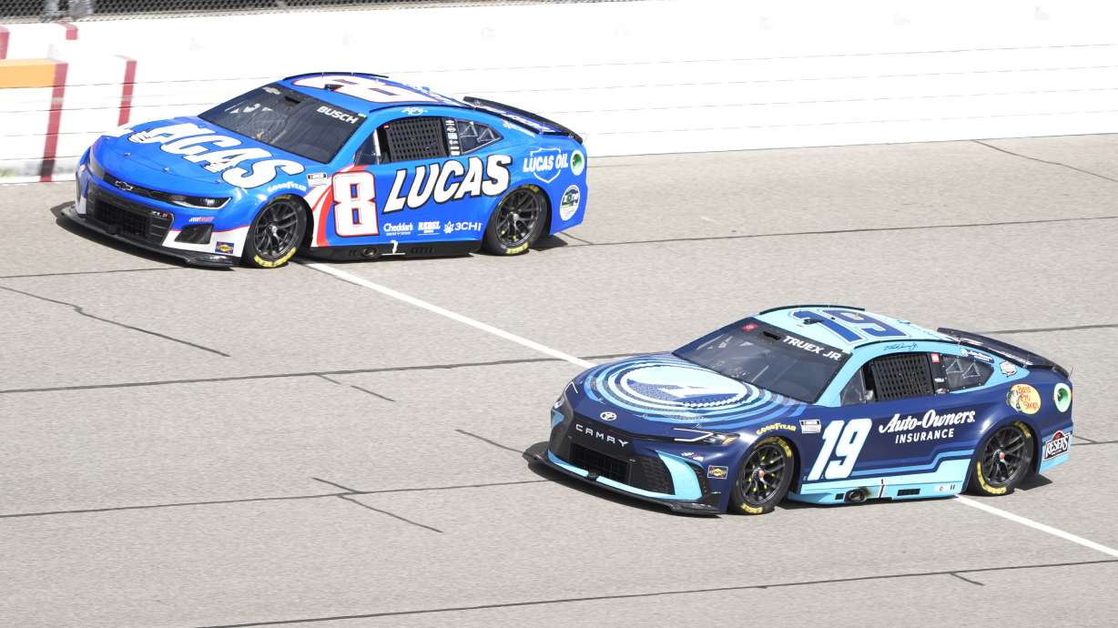FILE - Kyle Busch (18) and Martin Truex Jr. (19) drive during a NASCAR Cup Series auto race at Michigan International Speedway, Monday, Aug. 19, 2024, in Brooklyn, Mich.